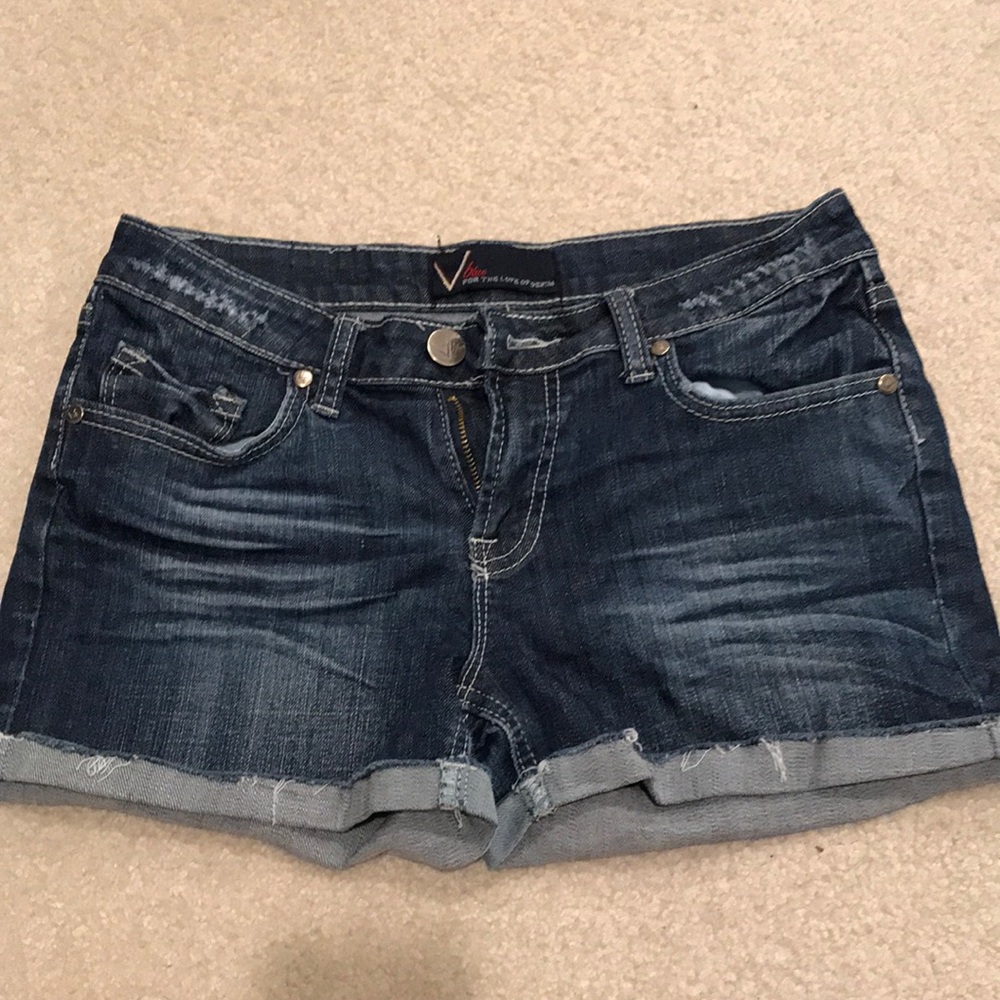 V blue denim shorts